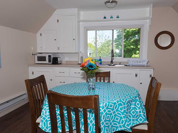 Large kitchen/dining room. Large storage closed off to the side