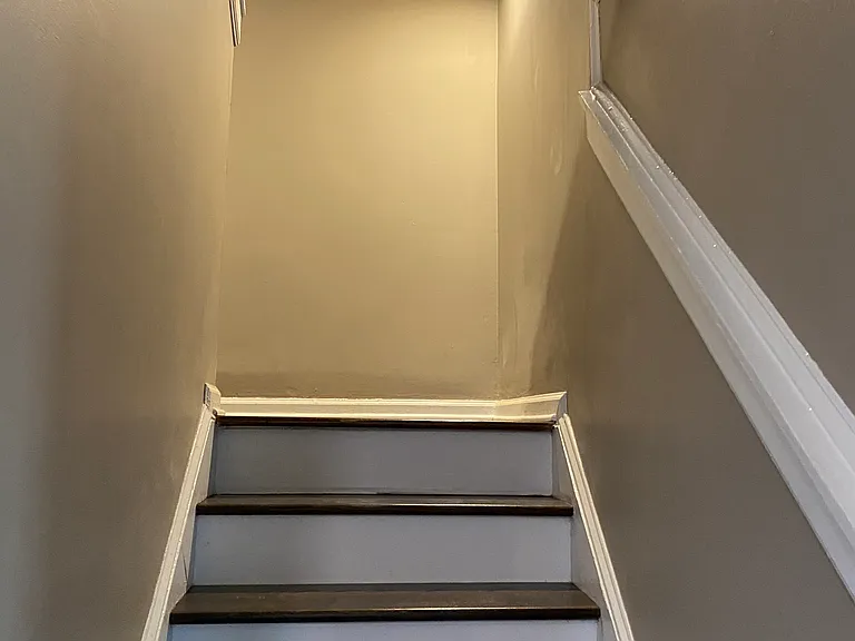 Lighted stairs to second floor with 4 bedrooms.