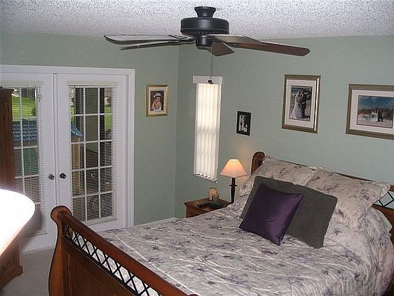 Master Bedroom with French Doors out to Large Screened Porch