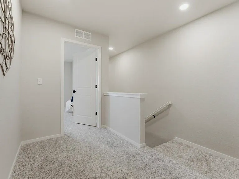The view from the top of the stairs entering the primary room