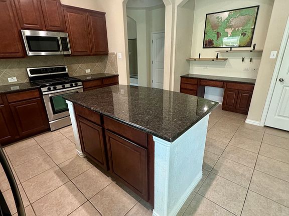 kitchen with an island, wet bar/coffee bar