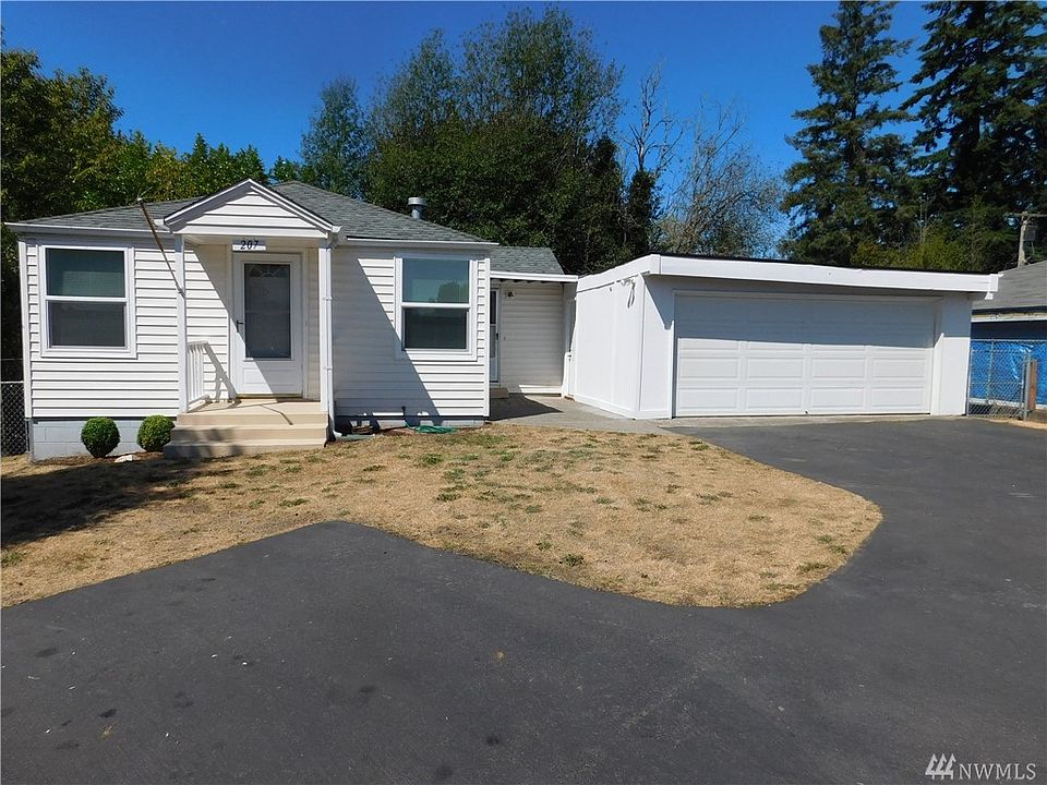Home with double car garage.  Notice all the parking and there in more than shown in this photo.