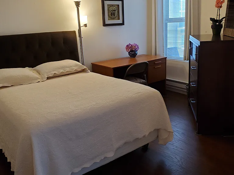 Second bedroom with full size bed, chest drawers and closet space, desk and chair