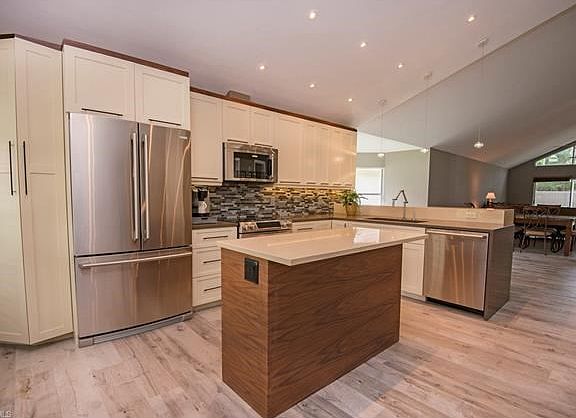 All NEW stainless appliances & decorative back splash.