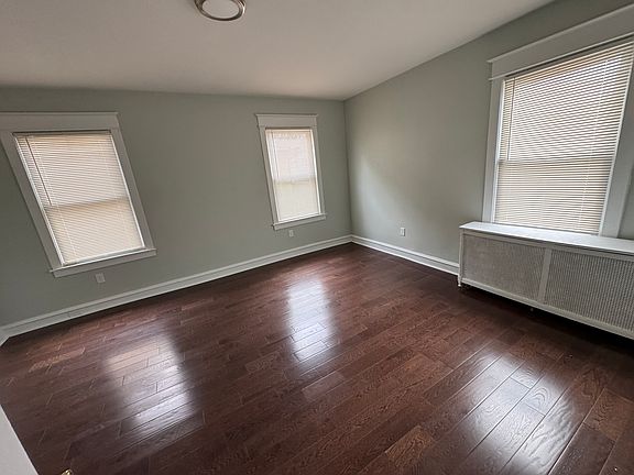 rear bedroom (or use as dining room) brand new hard wood floors