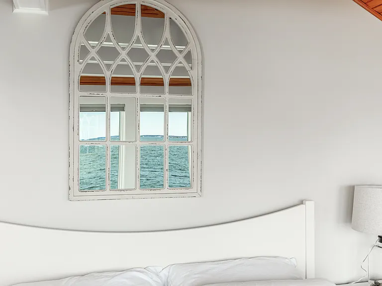 The third floor master bedroom with a king bed. Panoramic ocean views.