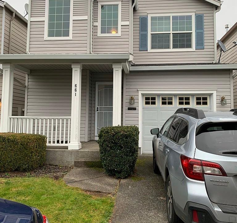 Front of house with driveway and street parking available