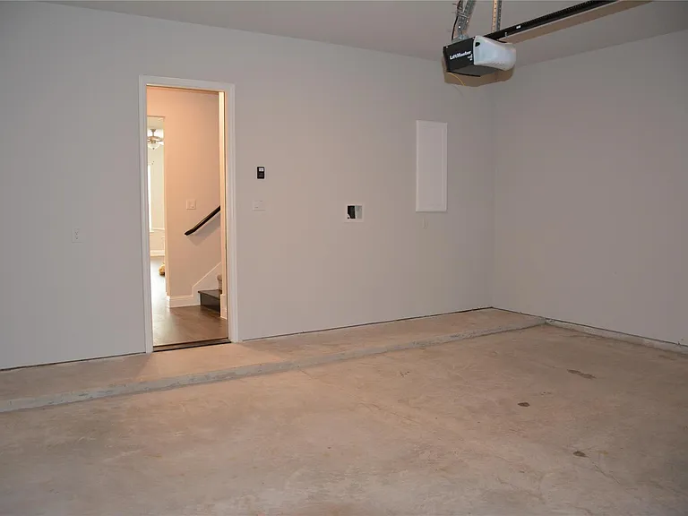 TWO CAR GARAGE WITH ROOM FOR EXTRA STORAGE