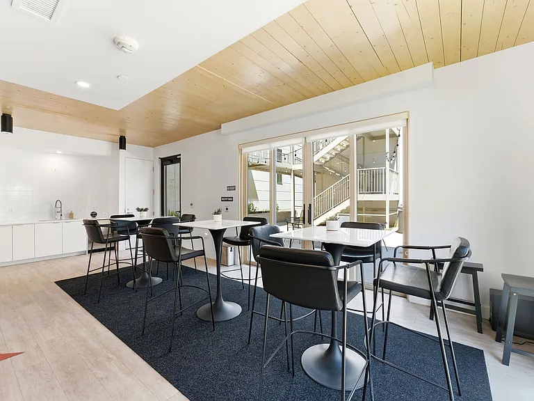Common Lounge. Opens into the patio area with gas firepit, BBQ and hot tub.