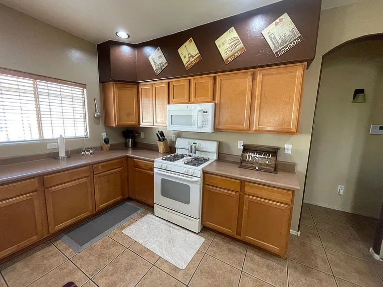 Kitchen with gas stove and microwave