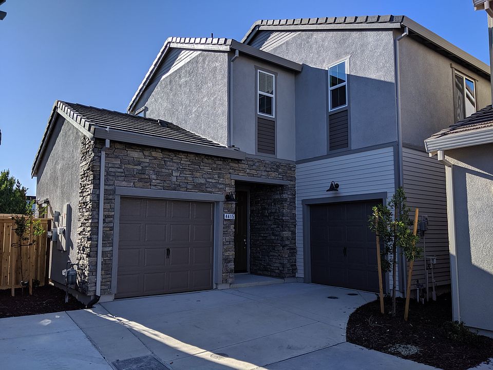The front of the house. Both garages are part of the house.