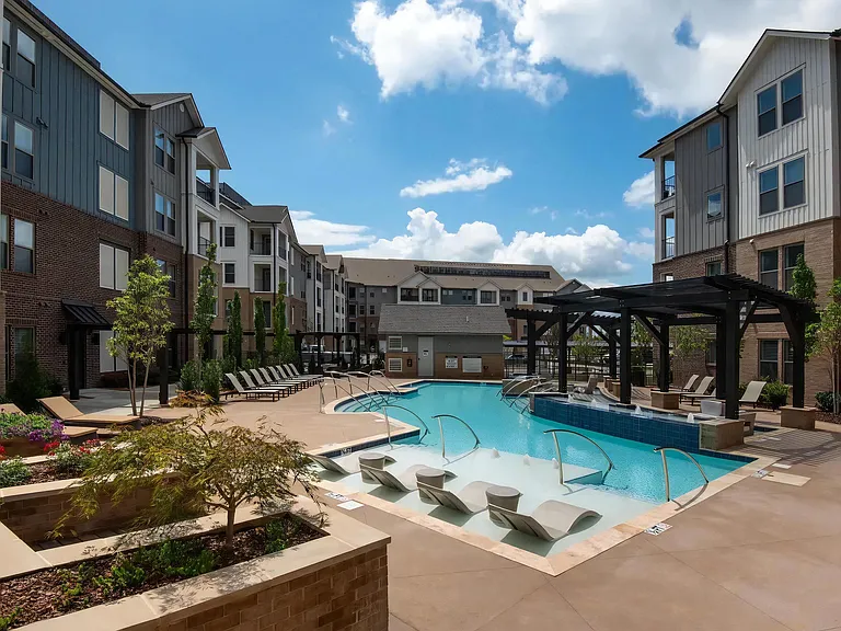 Courtyard Pool Area with Landscaping and Ample Lounge Chairs