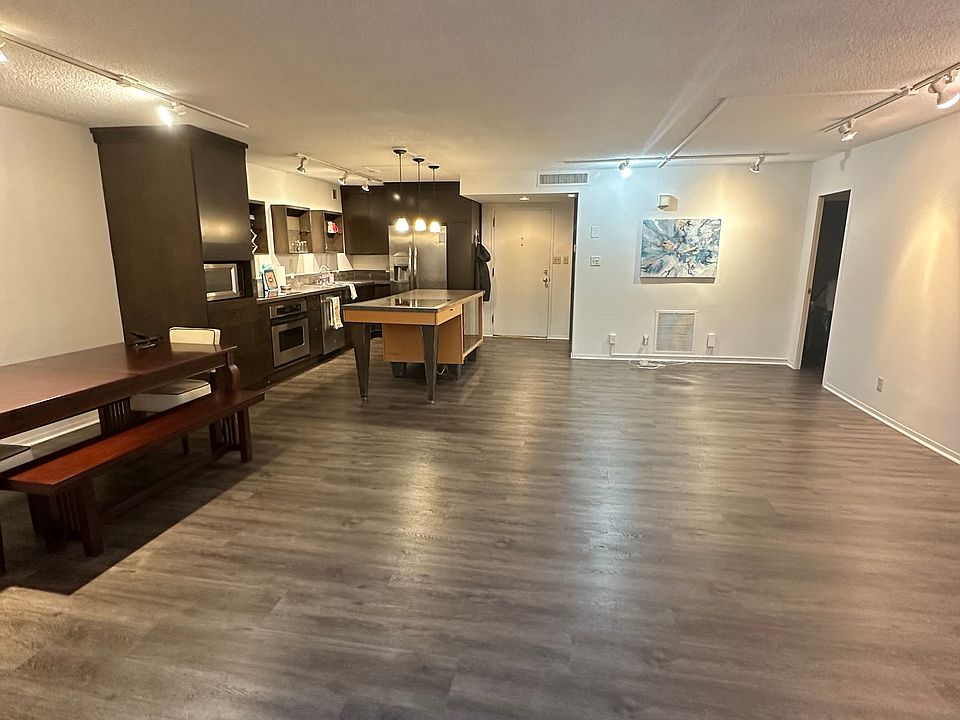 View of kitchen, dining area, living room from balcony