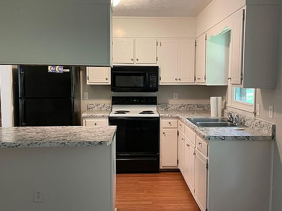 Kitchen with new countertops and waterproof flooring