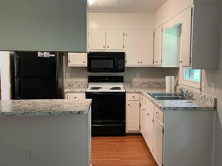 Kitchen with new countertops and waterproof flooring