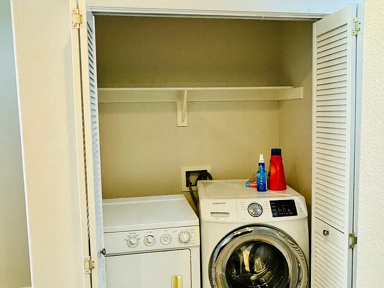 Full size laundry next to kitchen