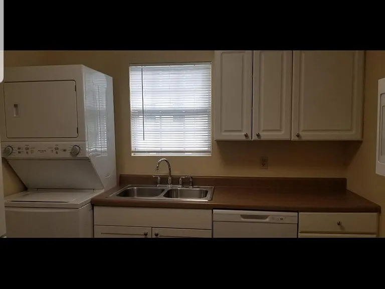 modern cabinetry and full sized dishwasher