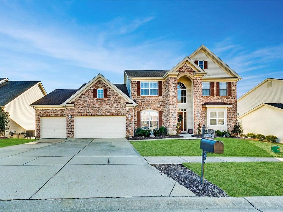 Welcome home to this immaculate 1.5 story home in the heart of The Legends!