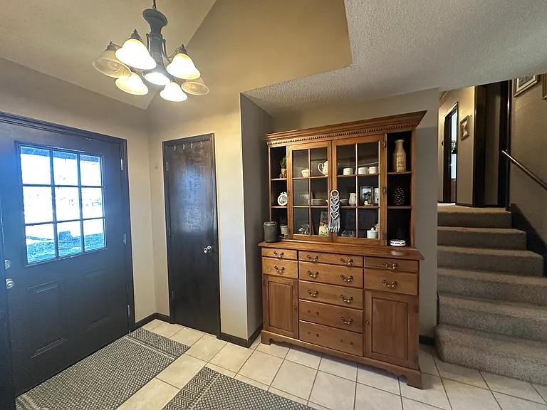 The tiled foyer provides a welcoming entry point into the home.