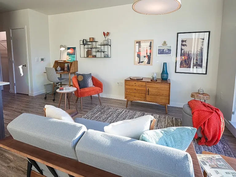 Sustainable wood plank-style flooring throughout