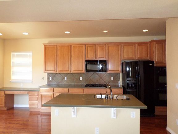 Nice Kitchen with Island, Double Ovens, & Built-In Desk