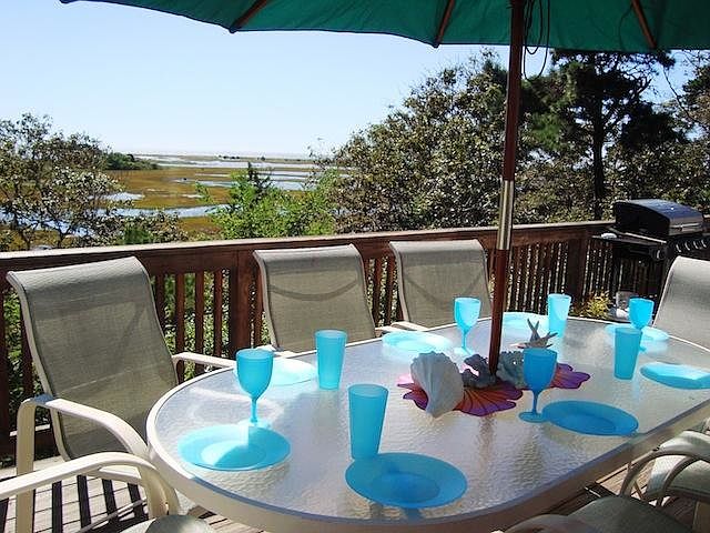 Deck with dining, gas grill and view of the Nantucket Sound