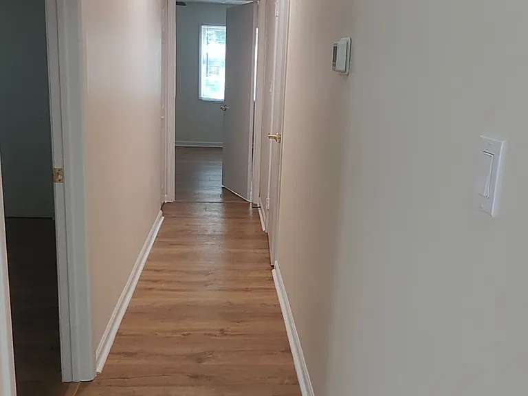 Hallway with kids bedroom door on the left