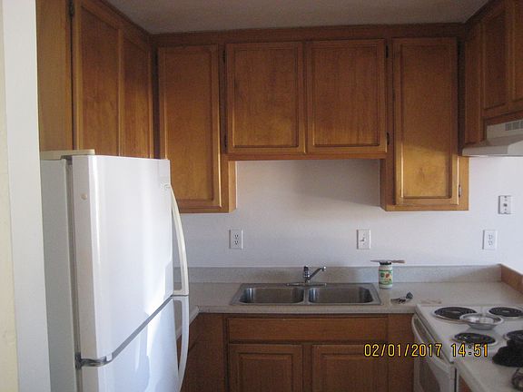 Good sized Kitchen that looks onto cute dining area which looks out onto large back patio. Lots of light. More large cupboards are across from sink.