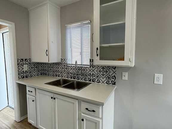 Stainless steel sink and updated cabinetry