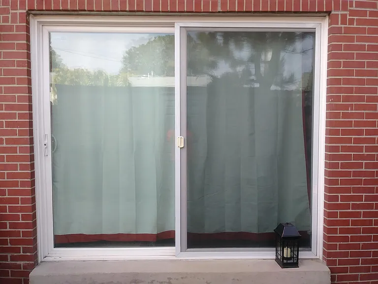 Custom, Oversized Sliding Glass Doors Lead Out To Private Patio