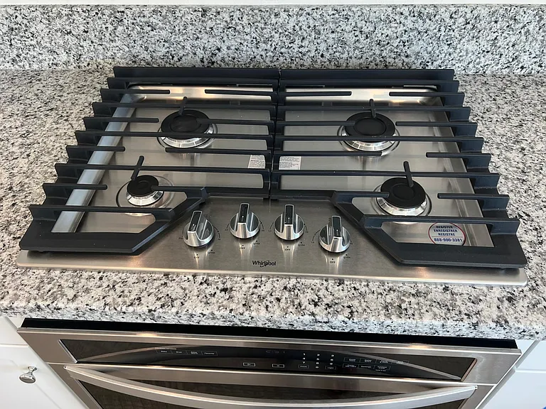 Stainless steel four-burner stove and oven