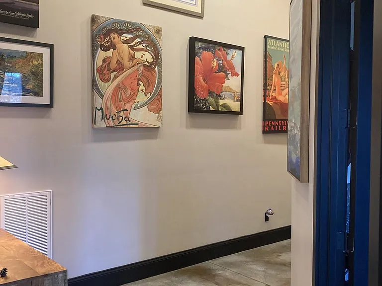 An expansive hallway leads from living area to two private bedrooms and shared bath.