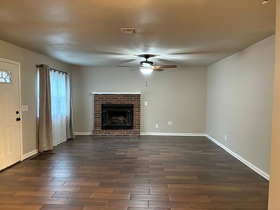 Open living area with new linen energy and noise reducing curtains, and sheers that create a comfortable homey vibe.