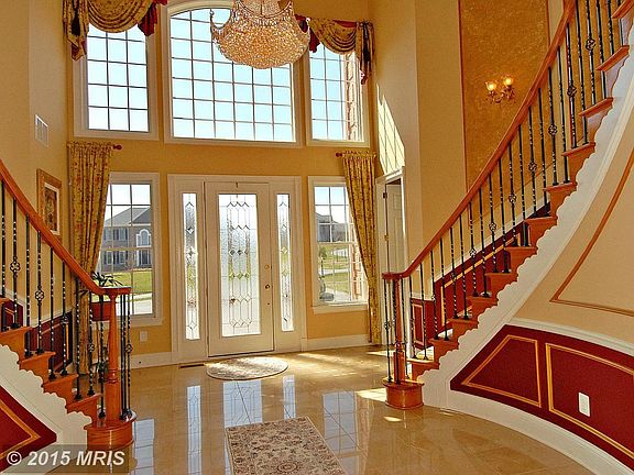 Two story foyer with porcelain tile