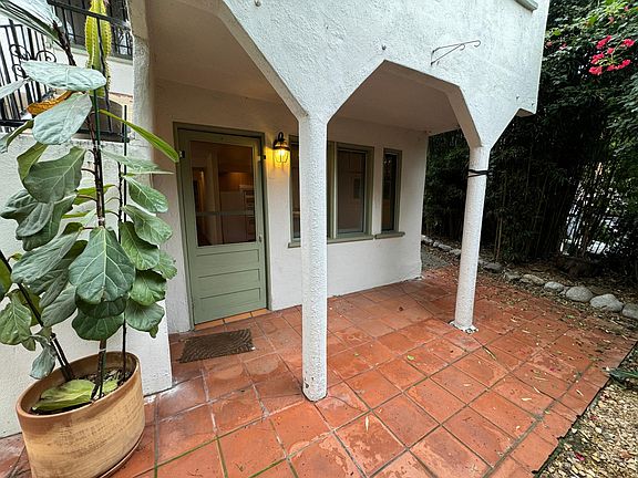 Tile patio and Front Door of Unit