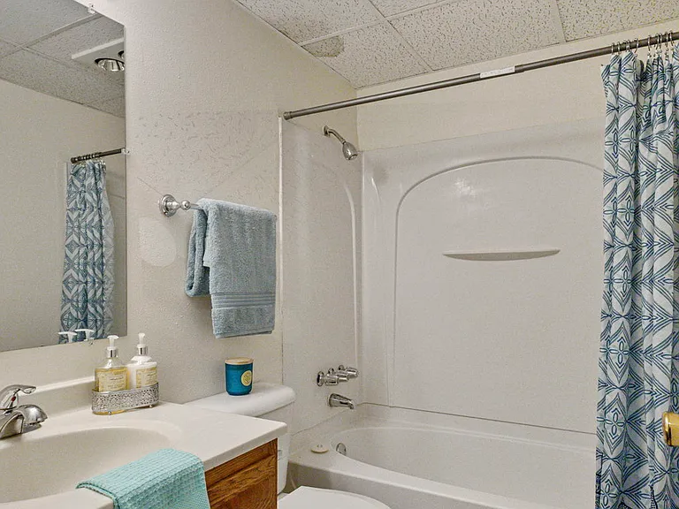 Staged bathroom with surround shower