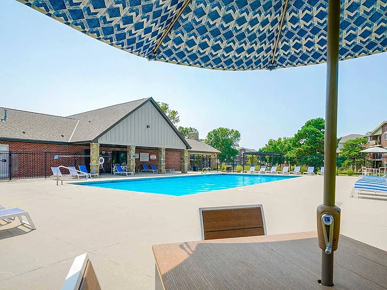 Relax poolside under the shade with seating perfect for lounging or dining.