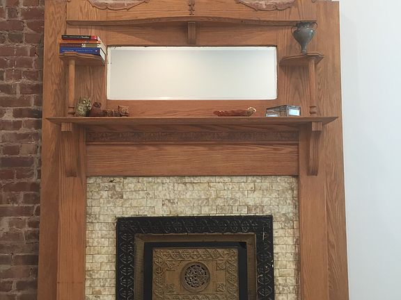 Restored original fireplace mantel
