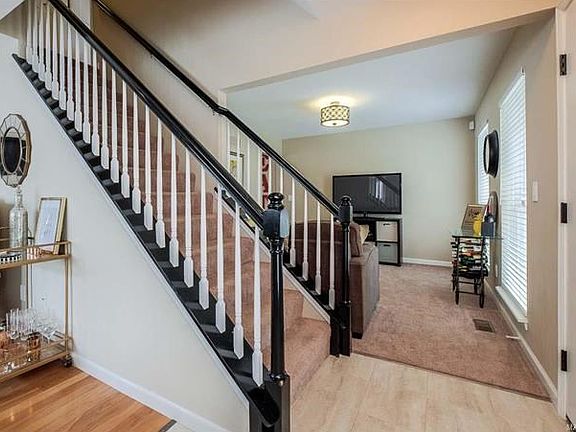 Step into the  foyer and you will be greeted with gorgeous updates. Let's begin with tile flooring in the foyer area.
