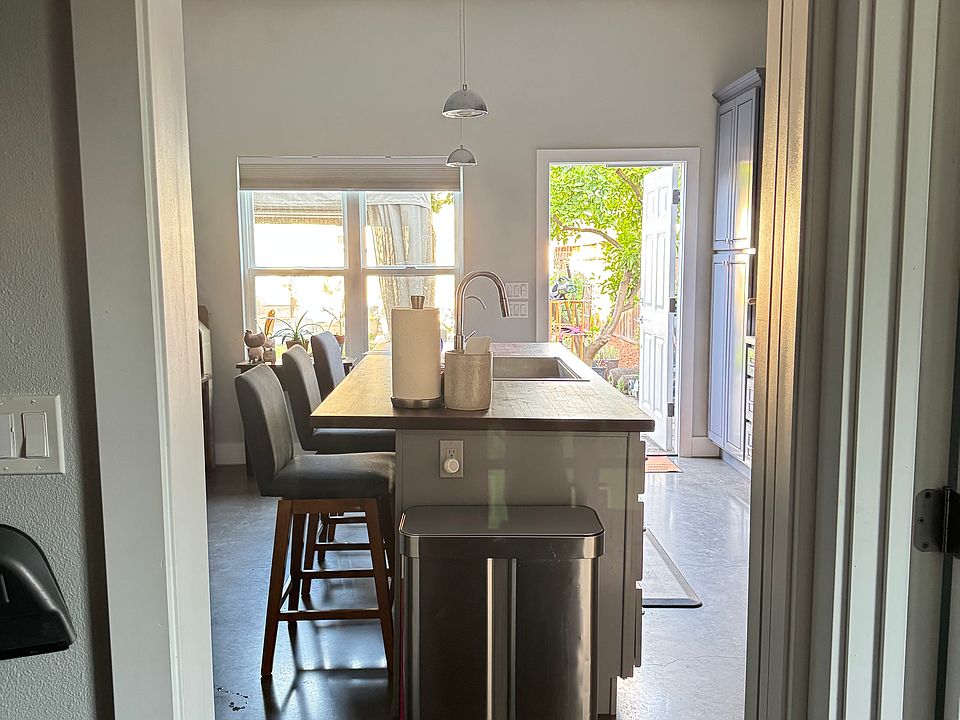 View from Utility Room facing Kitchen and front door.