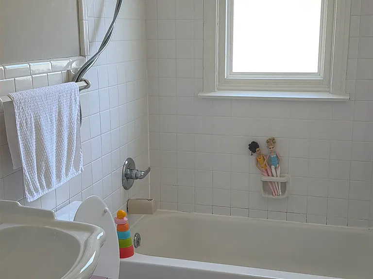 Second Bath features a bathtub and pedestal basin.