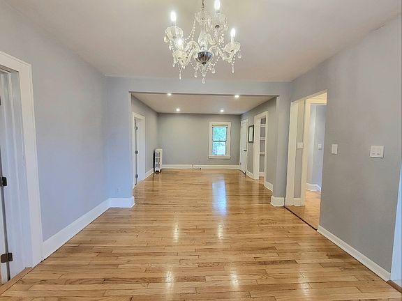 SPACIOUS OPEN DINING AREA AND LIVING ROOM