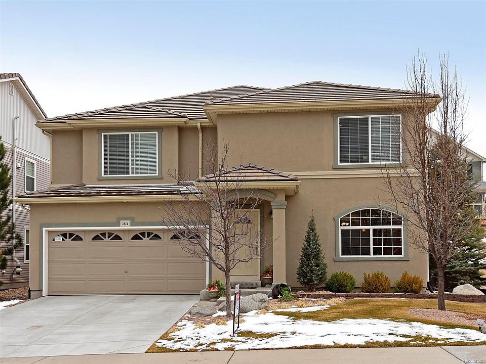 Front Stucco Exterior with Tile Roof.