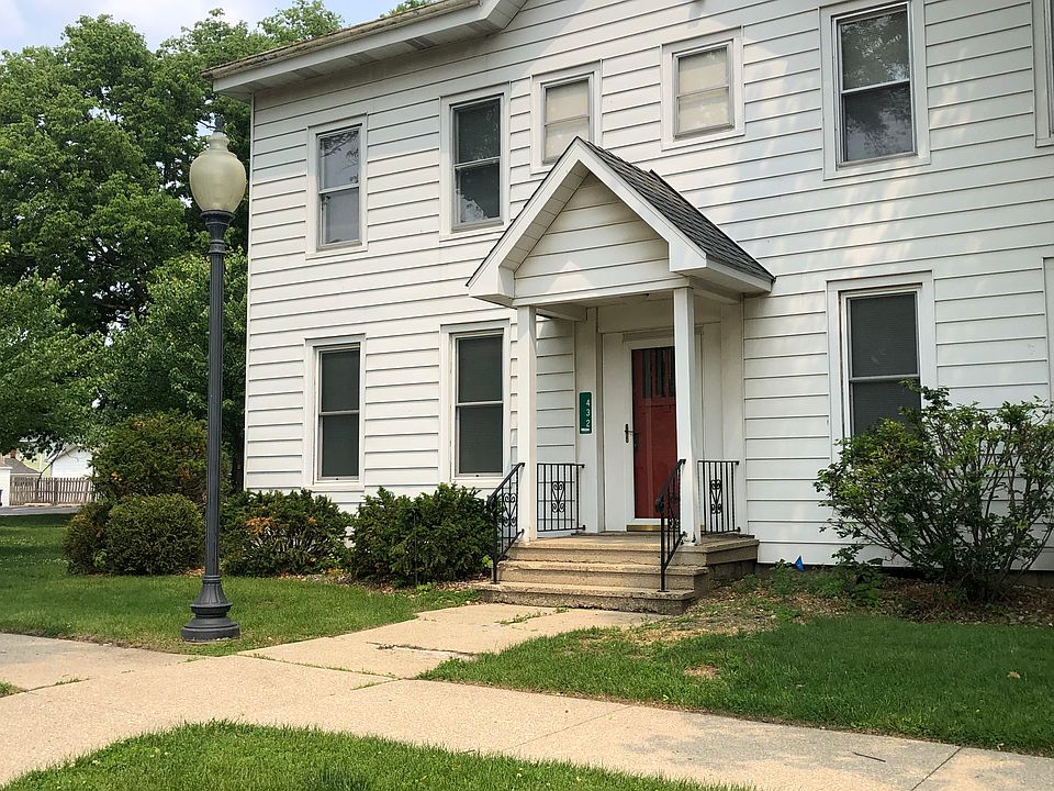 2 story building on corner lot with large yard