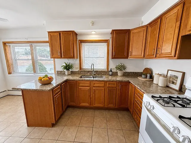 Kitchen with granite countertops and sunlight