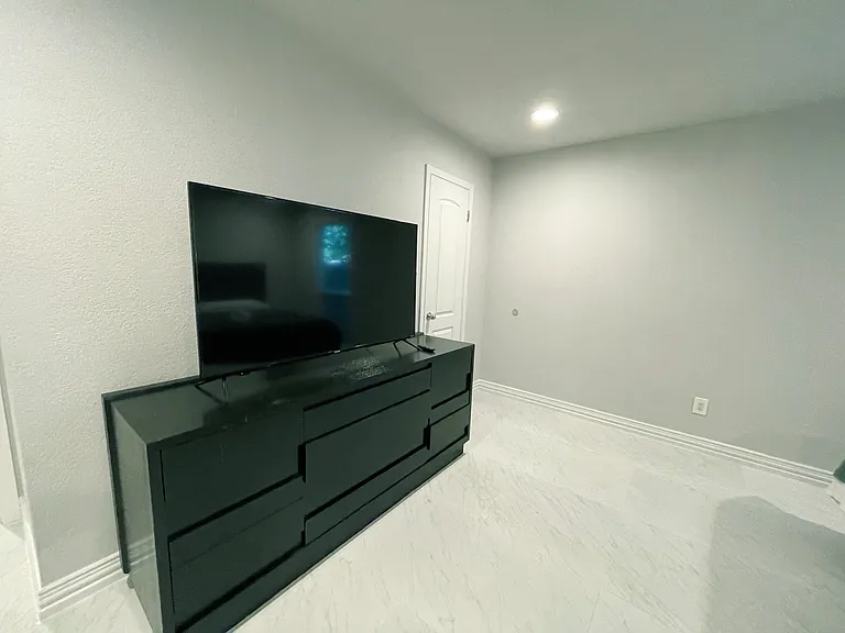 Master Bedroom with 55 inch Smart TV