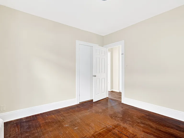 Bedroom with hardwood floors.