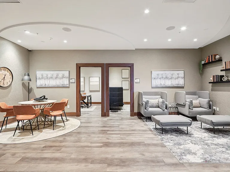 a room with couches and chair