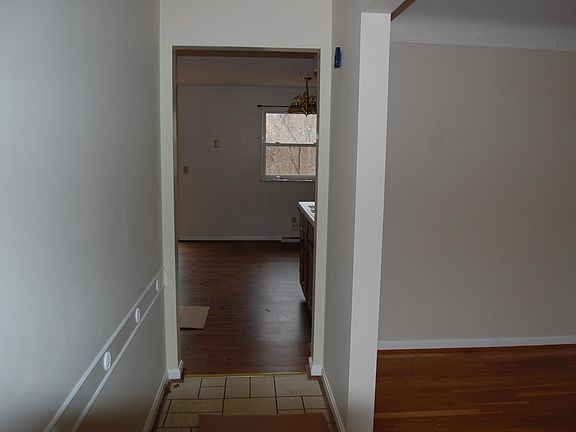 Entry way. Living room on right, Hall leads to kitchen/family room