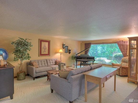 The formal living is large enough for a crowd! ( and a baby grand piano!)